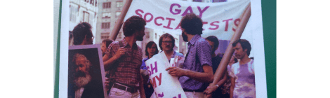 image of protesters holding a sign that reads gay socialists